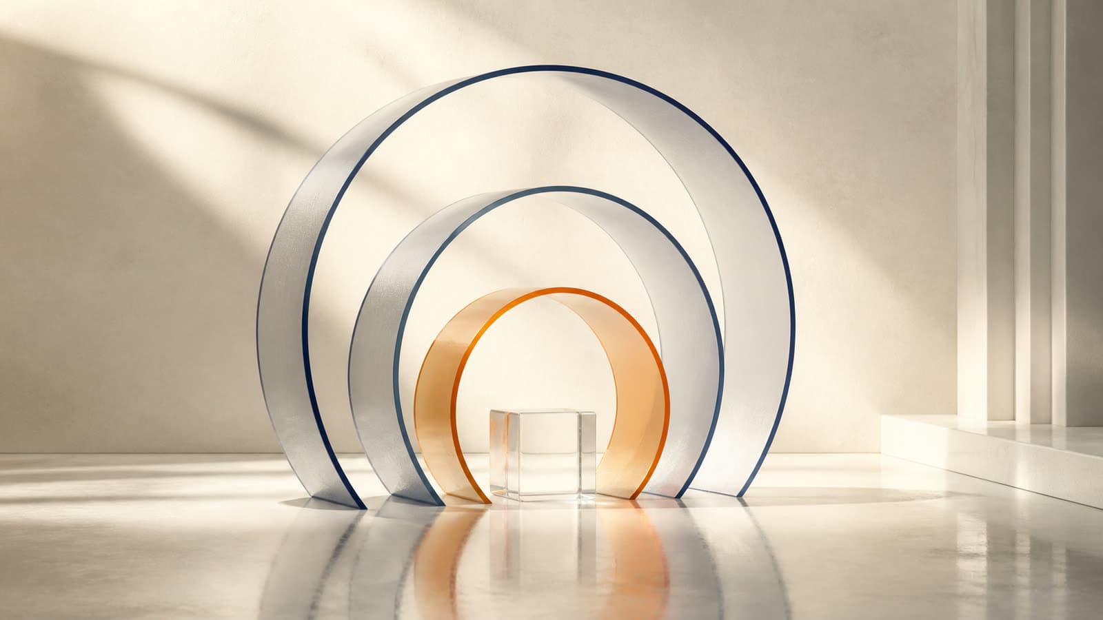 Trois anneaux de verre concentriques, le plus intérieur teinté terracotta, entourant un cube de verre transparent : les cercles de gouvernance autour de l'usage.